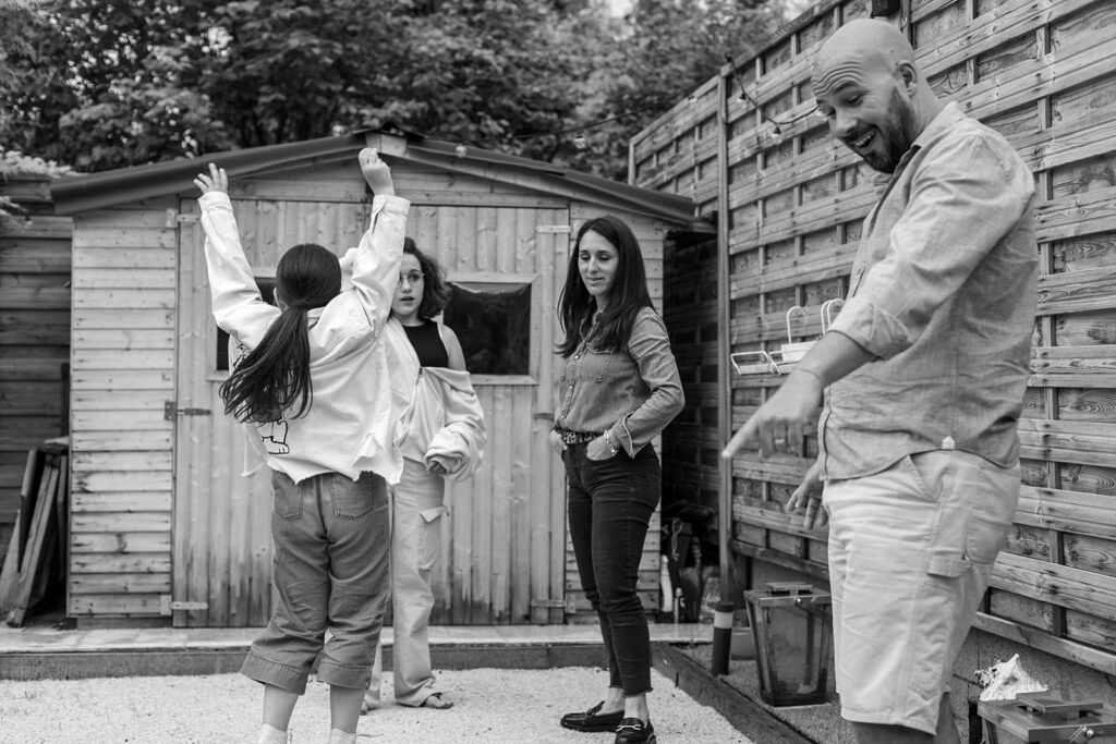 family playing a favorite game in their garden