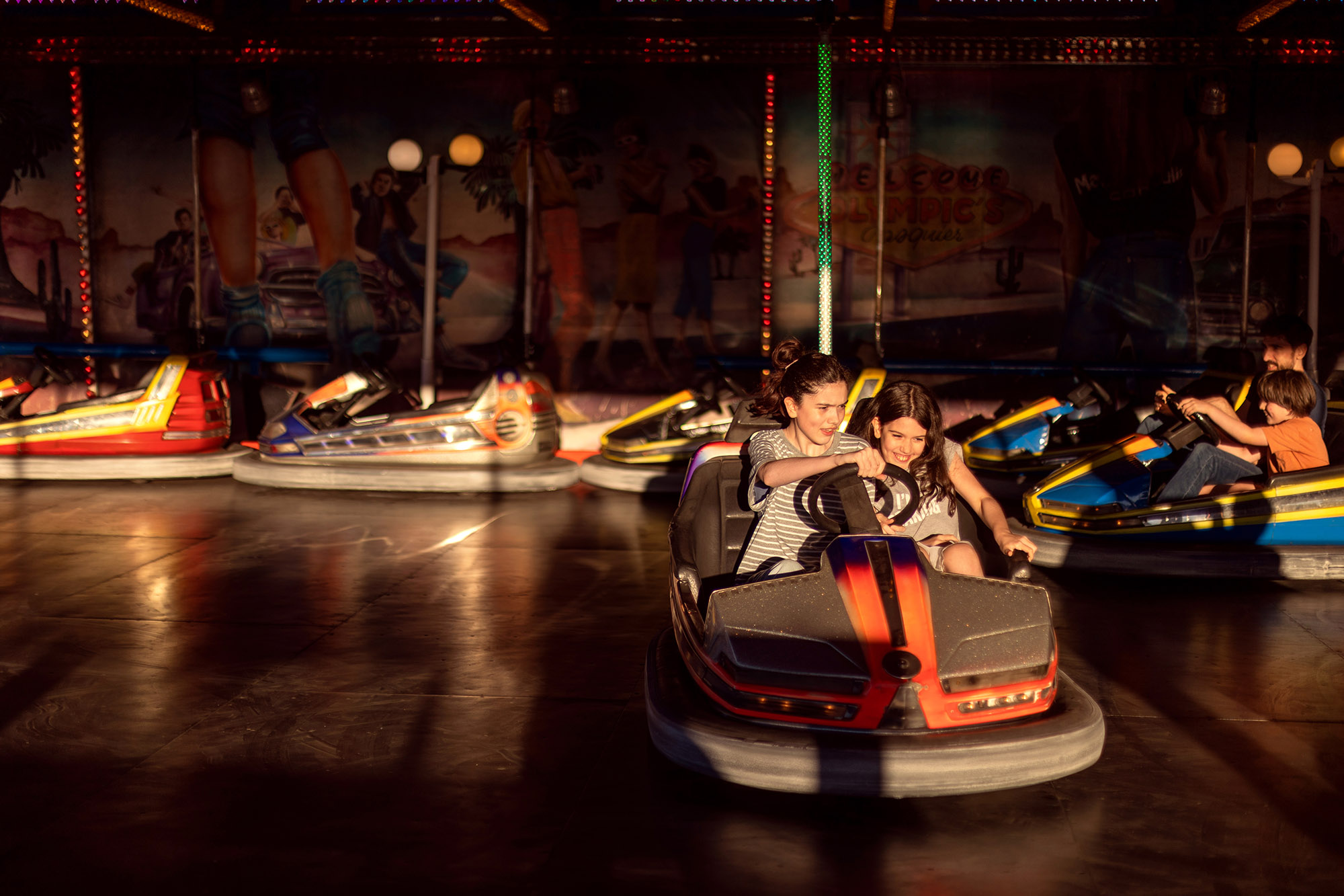Children riding bumper cars at a funfair