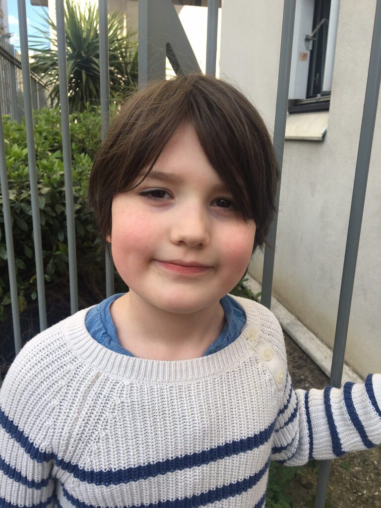 Child photographed in softer open shade outdoors