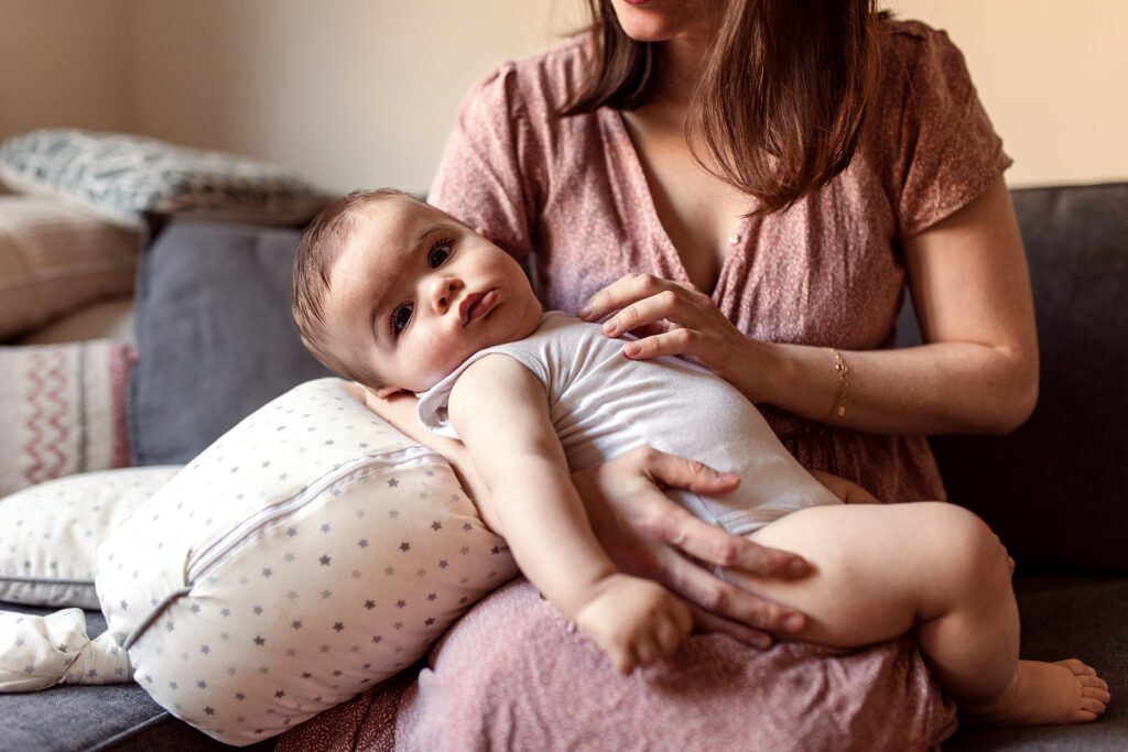 a mother cuddling with her baby