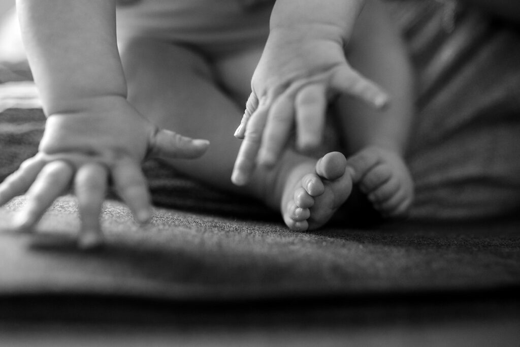 details of hands and baby feet