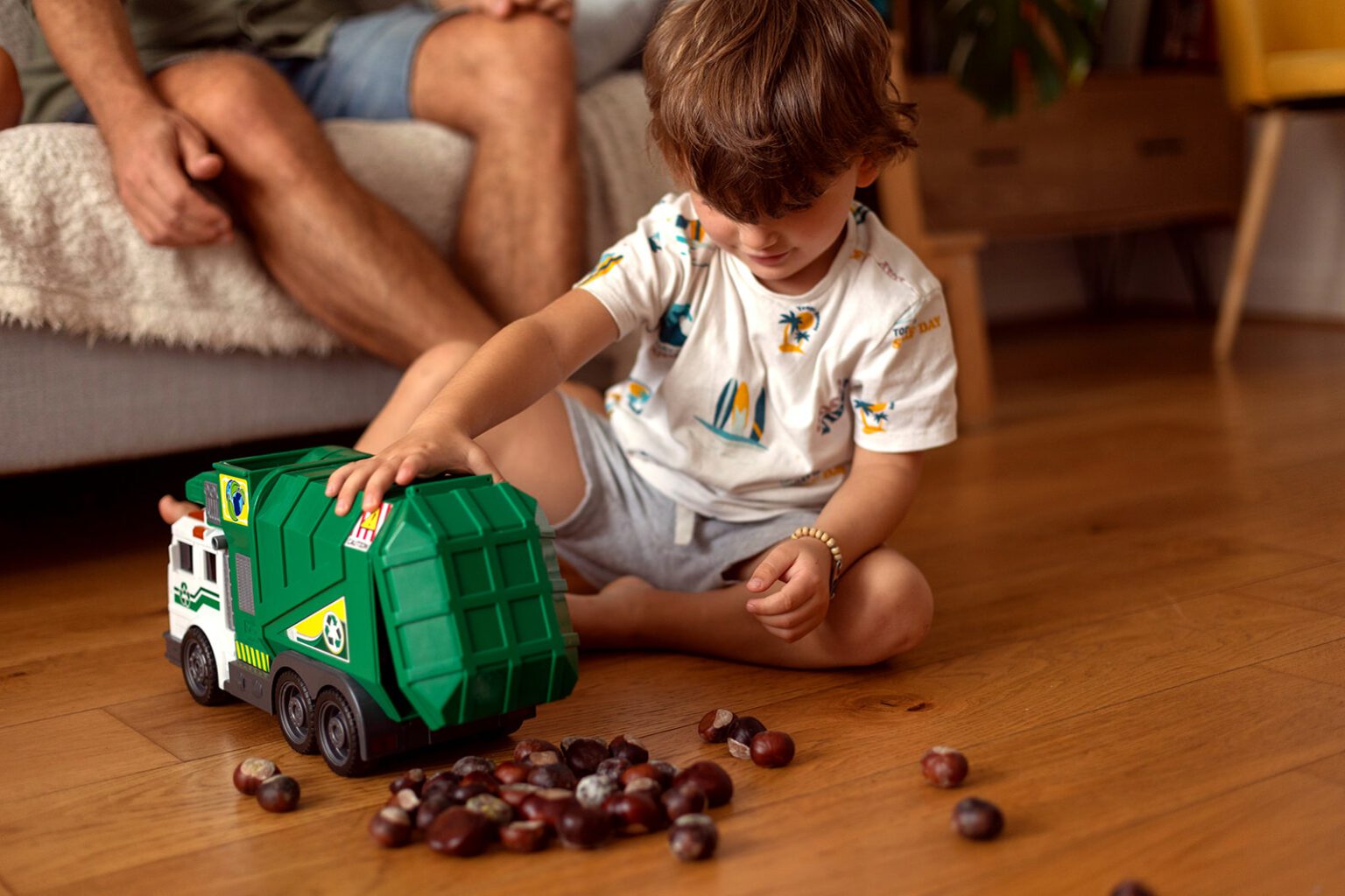 a little boy is playing at home