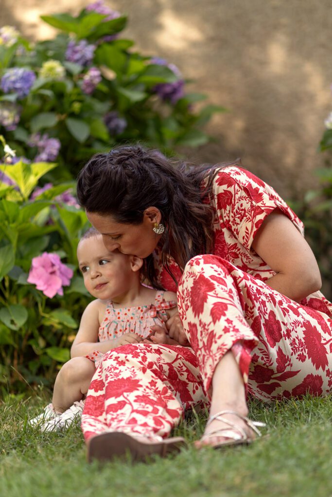 Everyday family moments photography, a mother and her baby sitting on the grass