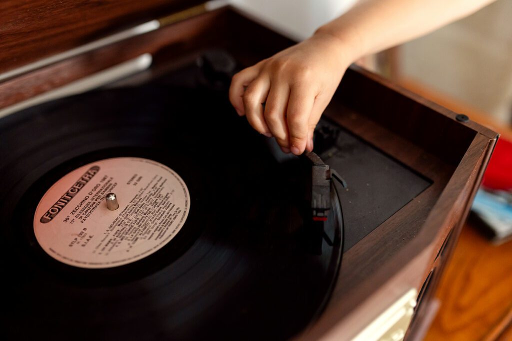 kid putting on a record