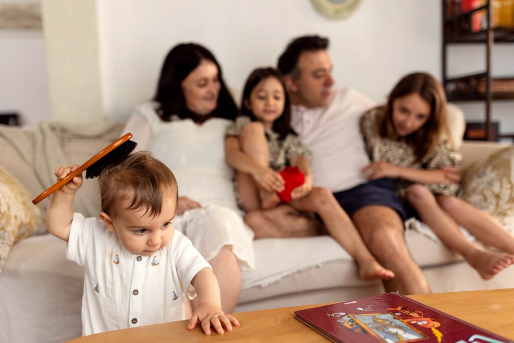 family posing in their living room for a Family photography session