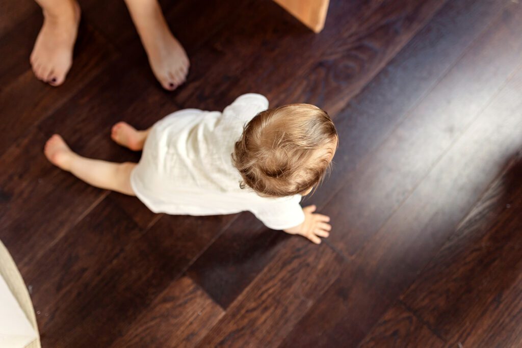 toddler sitting on the floor