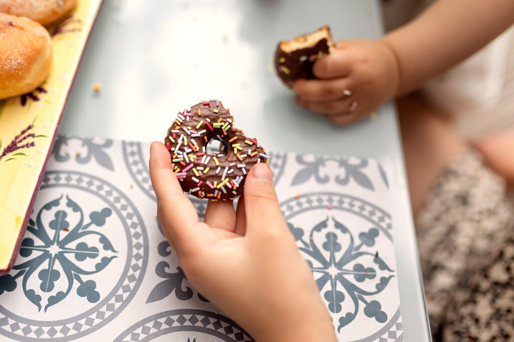 kid hands holding a cookie