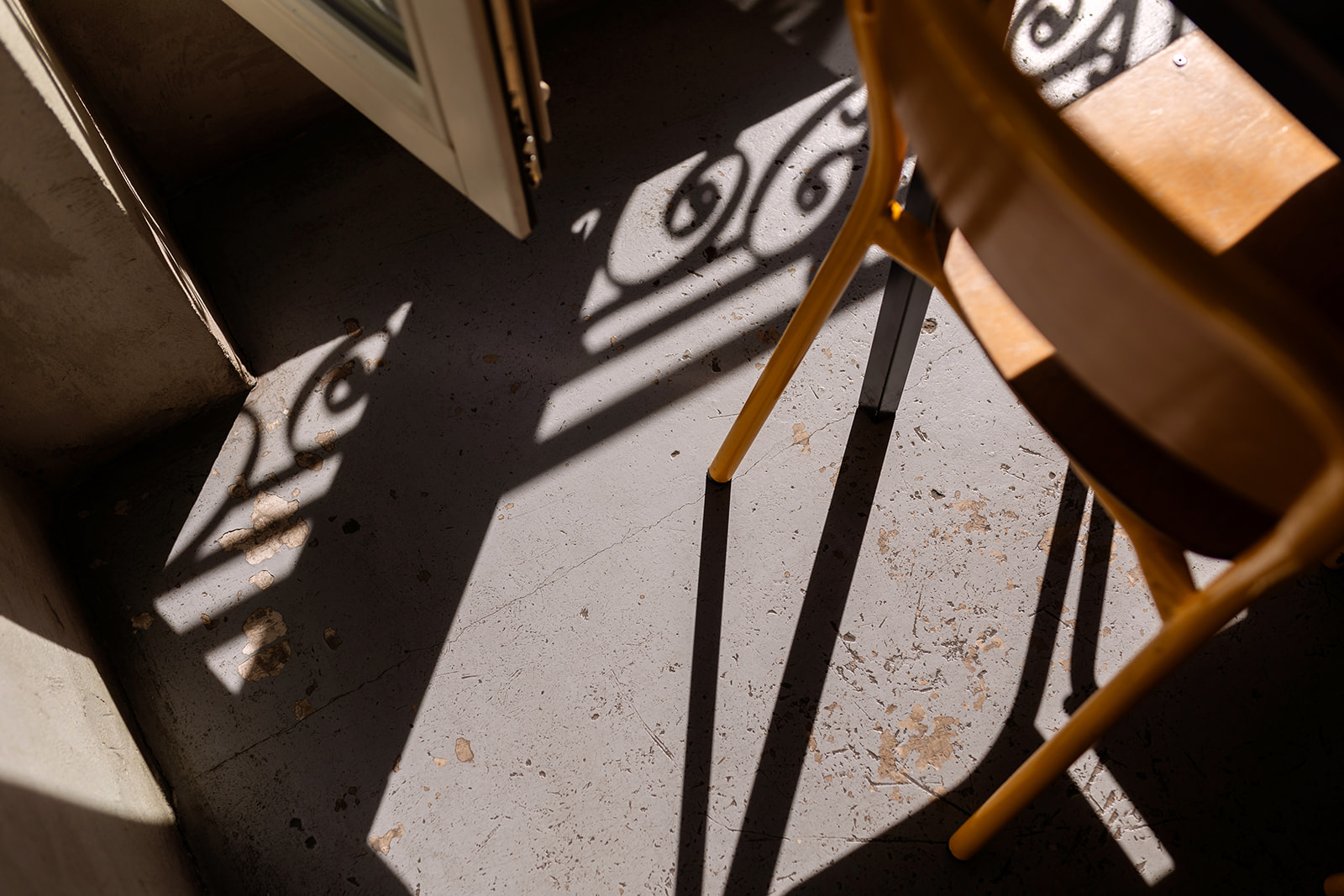 Long shadows across a restaurant floor in Paris