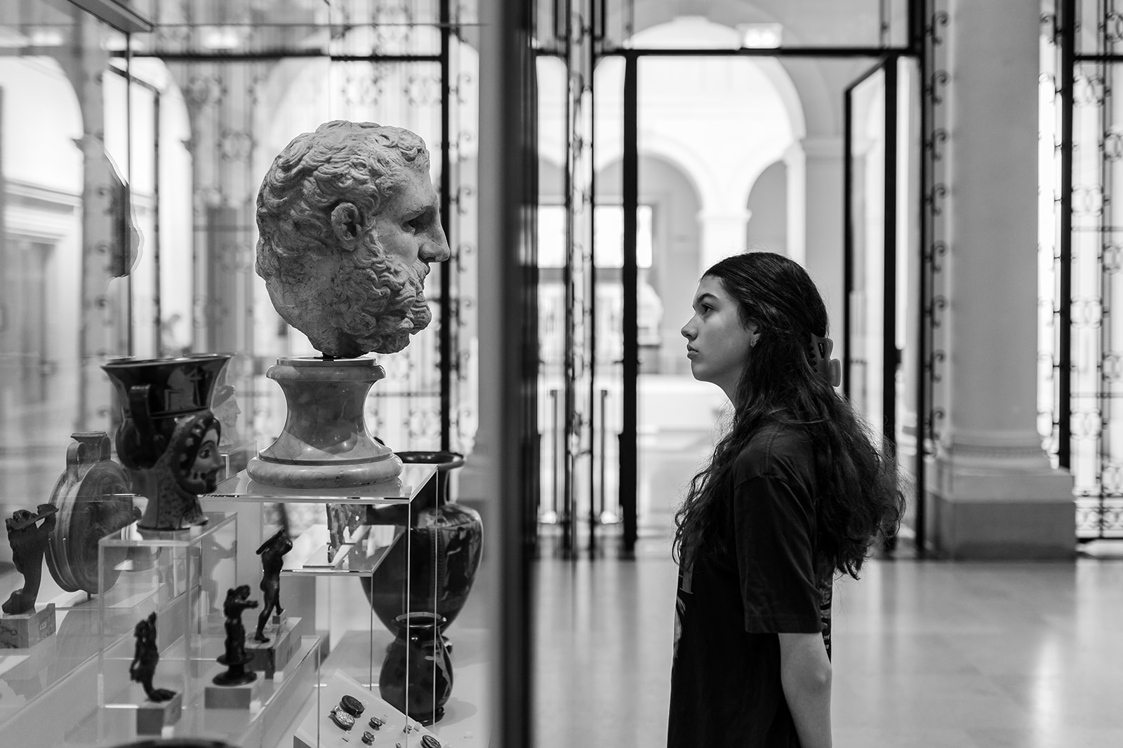 Teenager looking around a museum in Paris