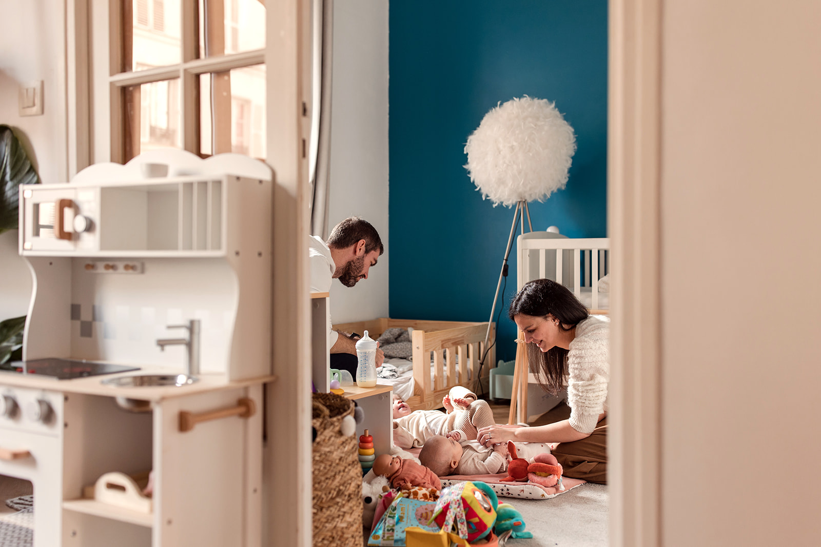 a family playing together in a kids room