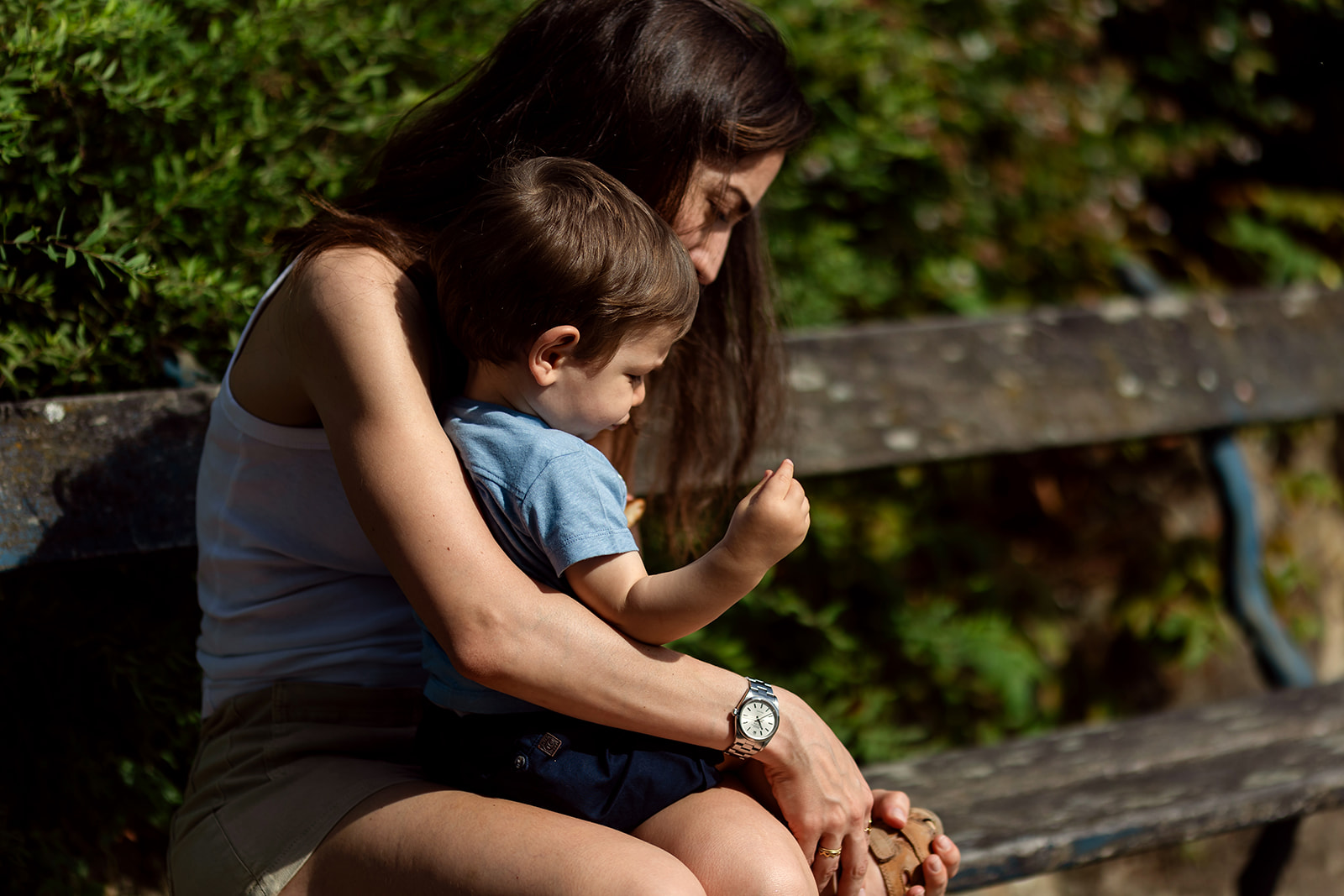 a mother helping her toddler put his shoes on, Everyday family moments photography