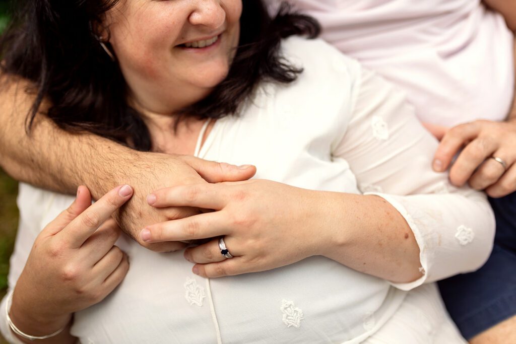 parents holding hands and smiling