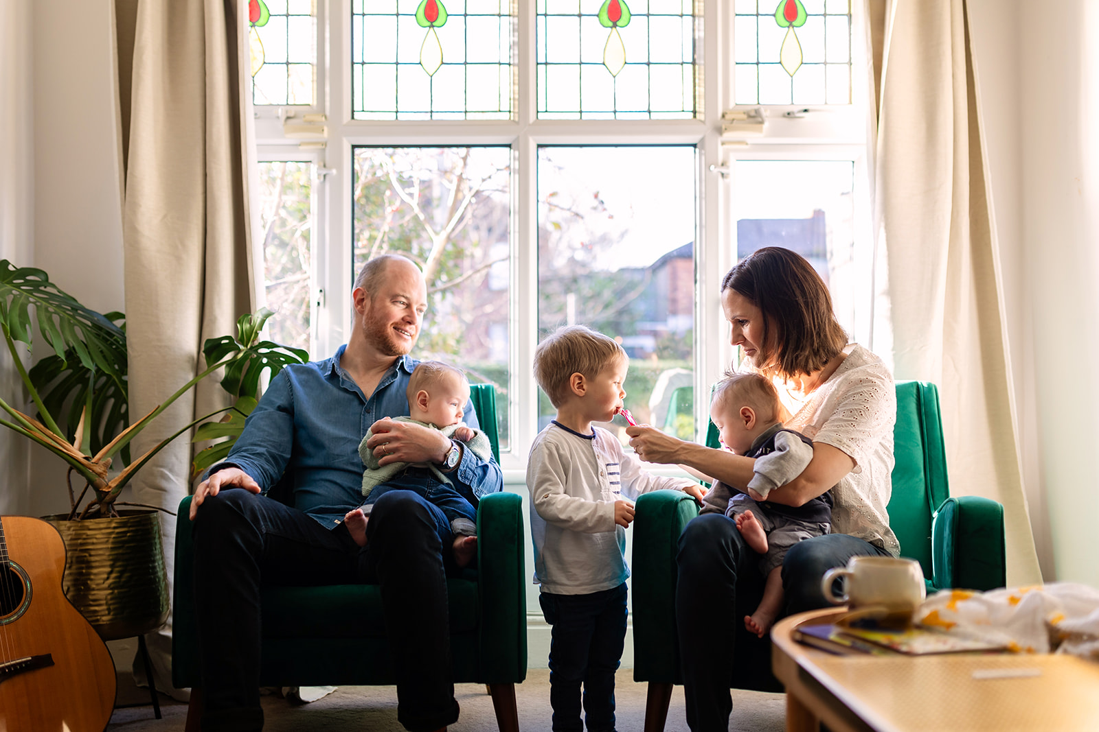 family sitting in their home