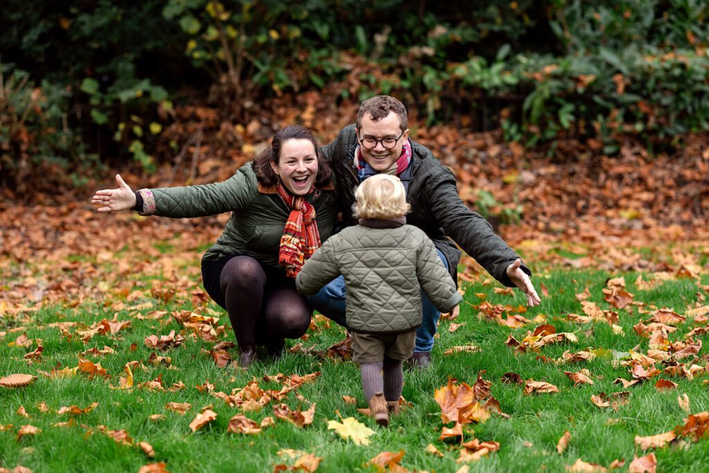 parents and child playing during a Saint Stephen's Green family photo session