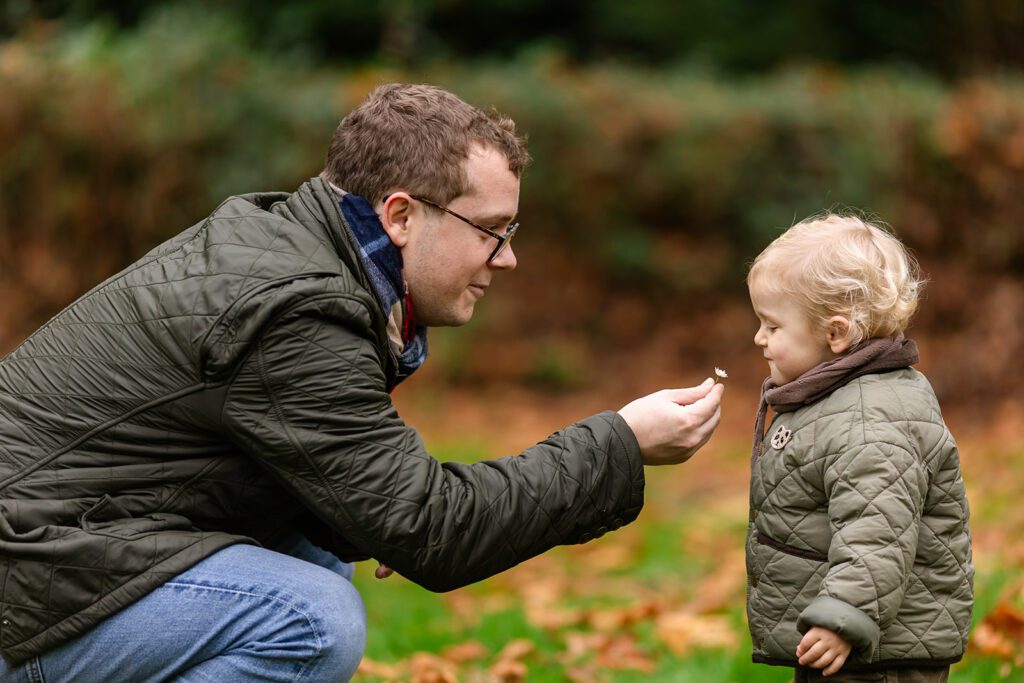 a father giving his child a flower