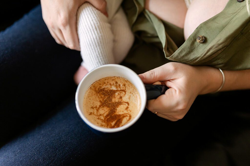 breastfeeding mother holding coffee