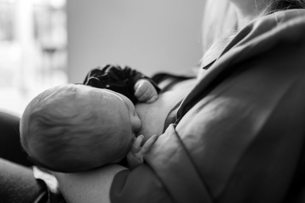 mother breastfeeding her newborn