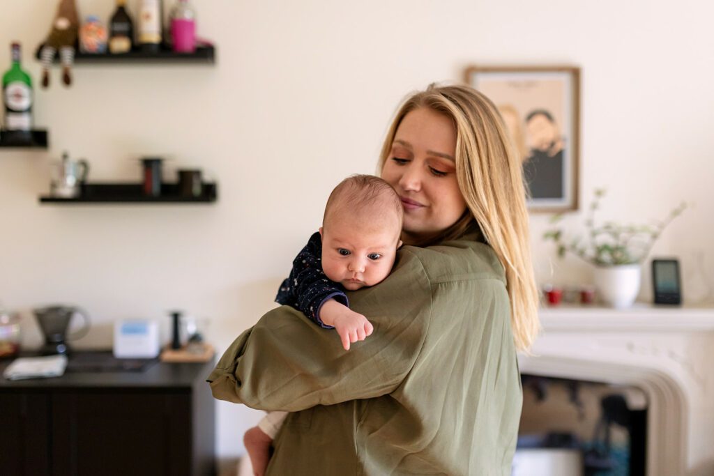 mother and newborn at home during a Professional newborn photography session in Dublin