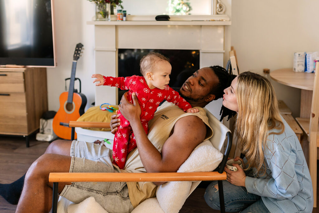 family cuddling in their home