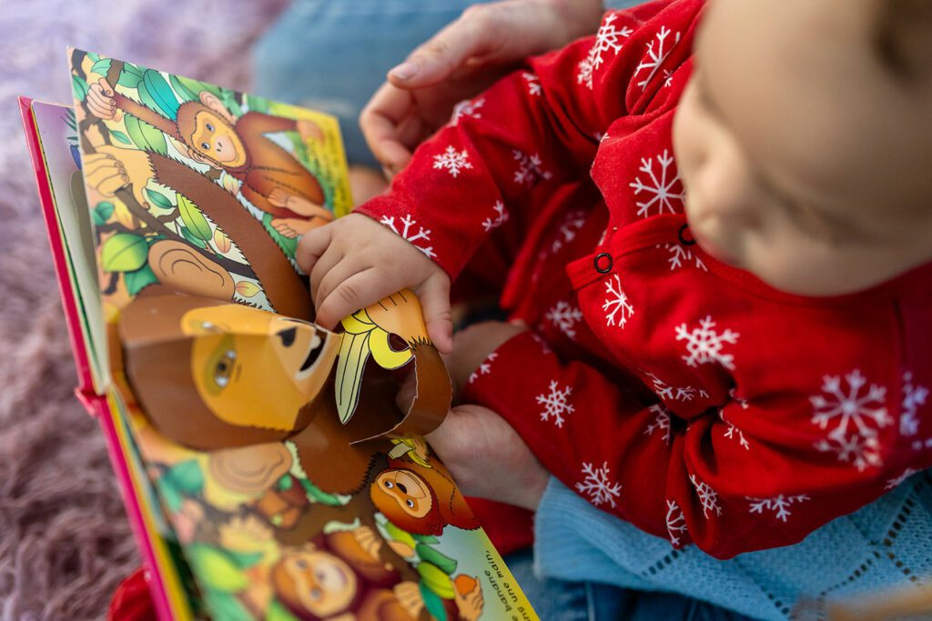 baby reading a children's book