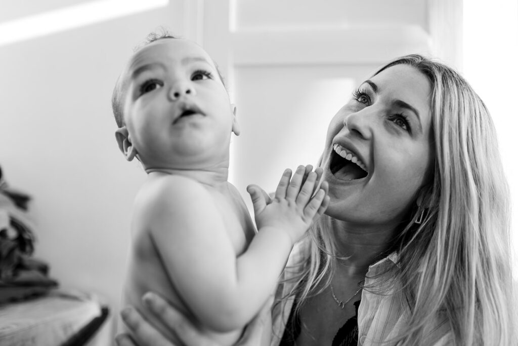 baby and mother laughing together