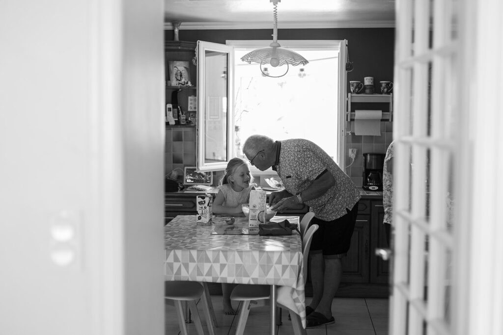 grandpa chatting with granddaughter, How to include grandparents in a family photo session