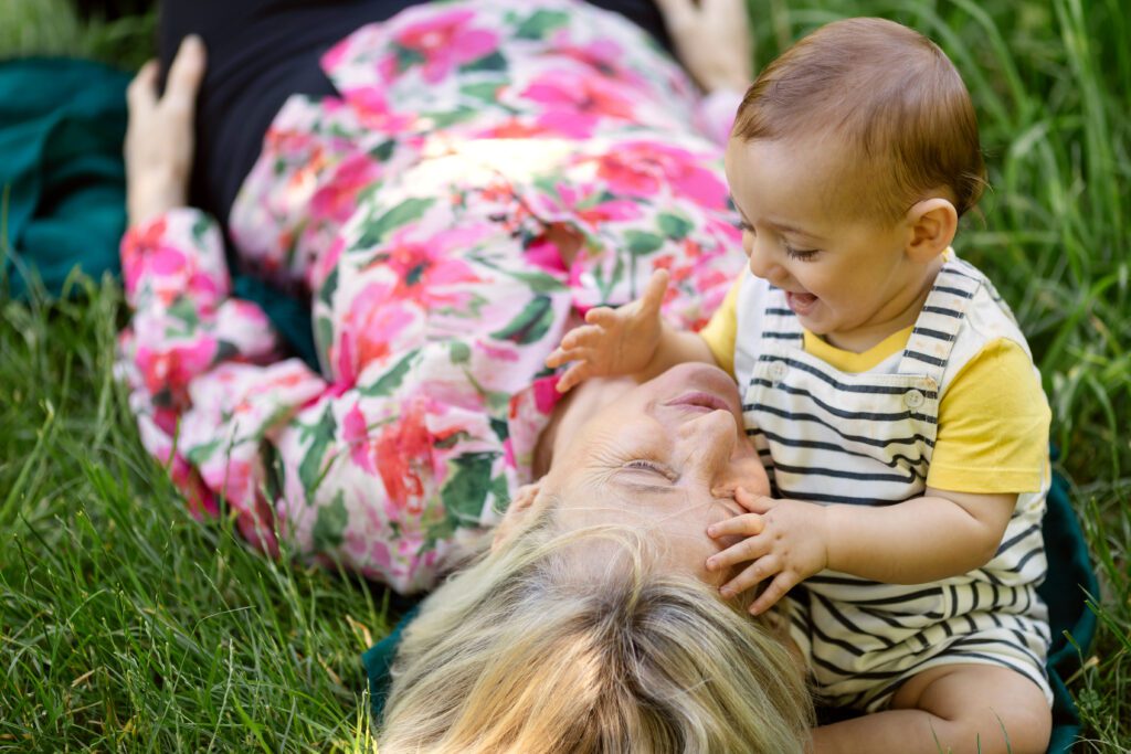 grandmother and her grandson cuddling at the park