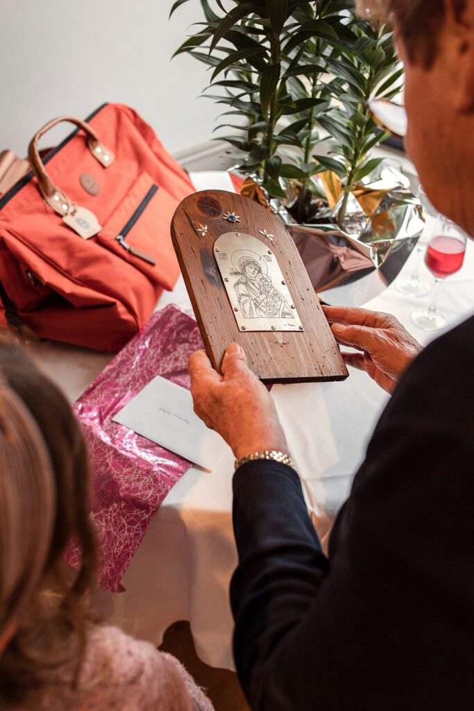 grandmother receiving a gift from her grandkids