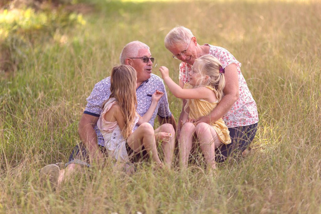 grandparents having fun with grandkids at the park