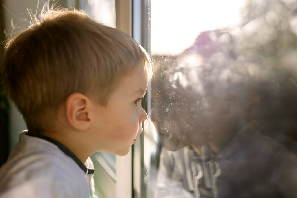 toddler looking out the window