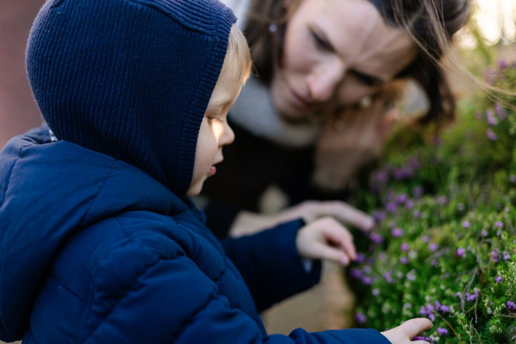 toddler and mother in their home garden