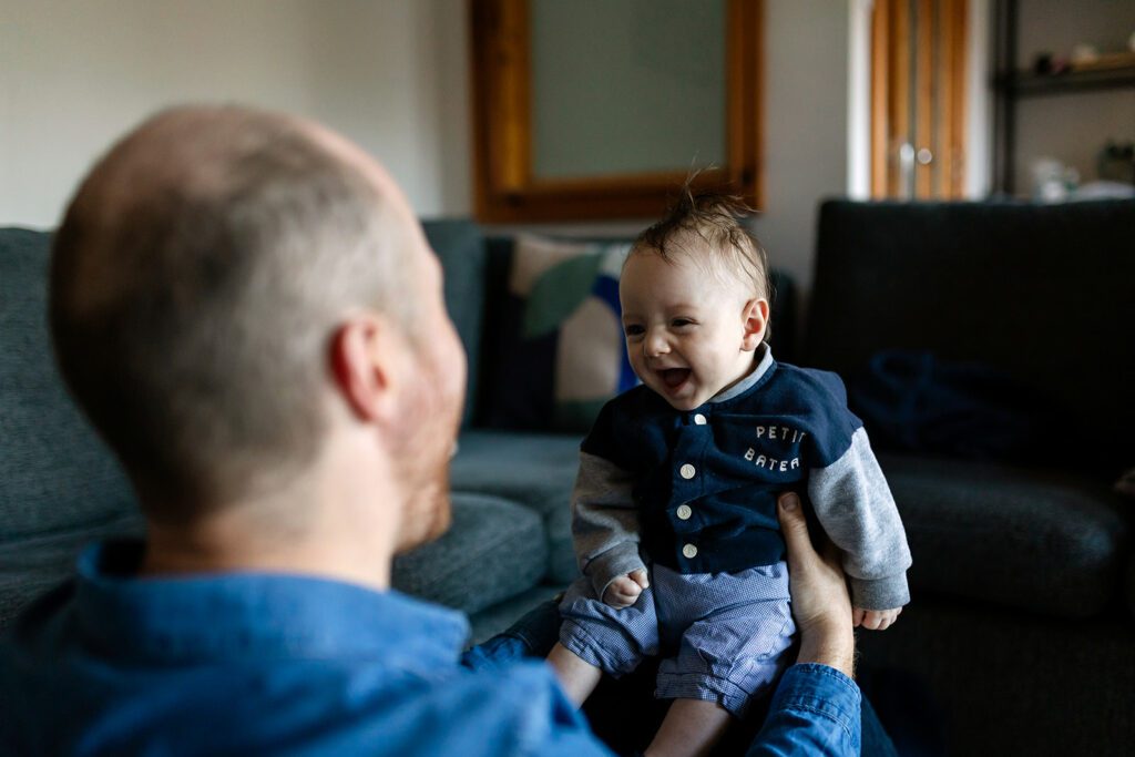 father playing with baby