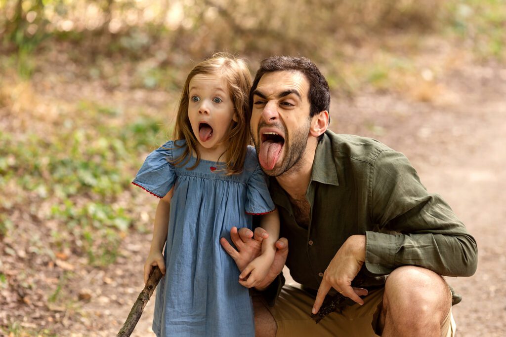 father and daughter making faces