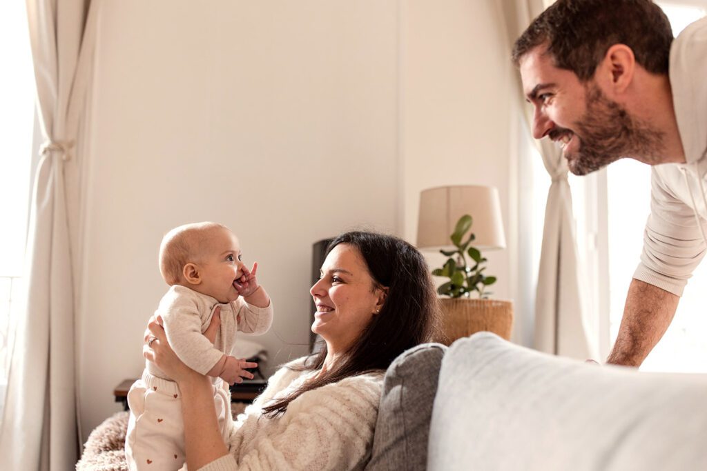 family playing with their baby