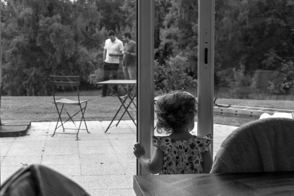 Best time of day for a family photo shoot, kid looking out the window