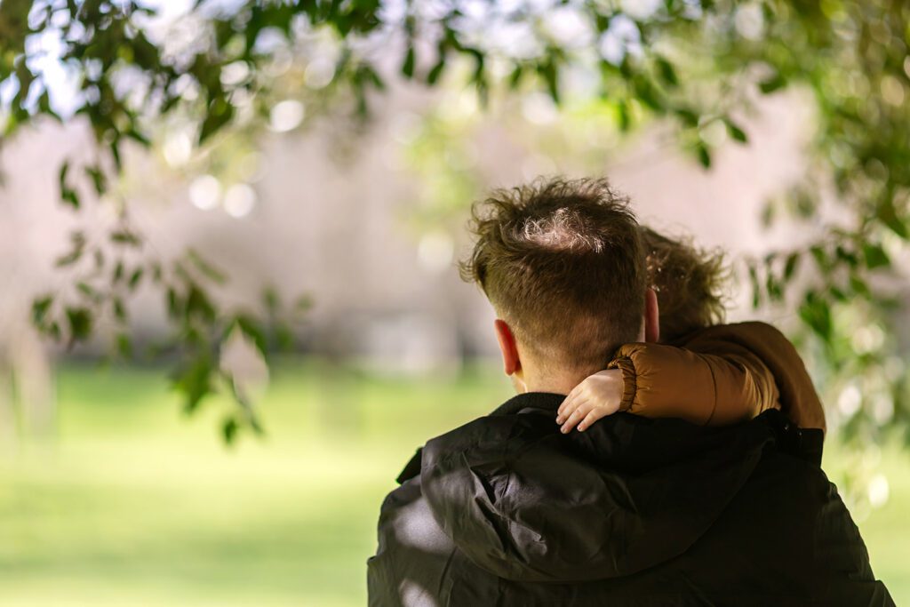 father holding toddler for Family photography Memorial Garden Dublin