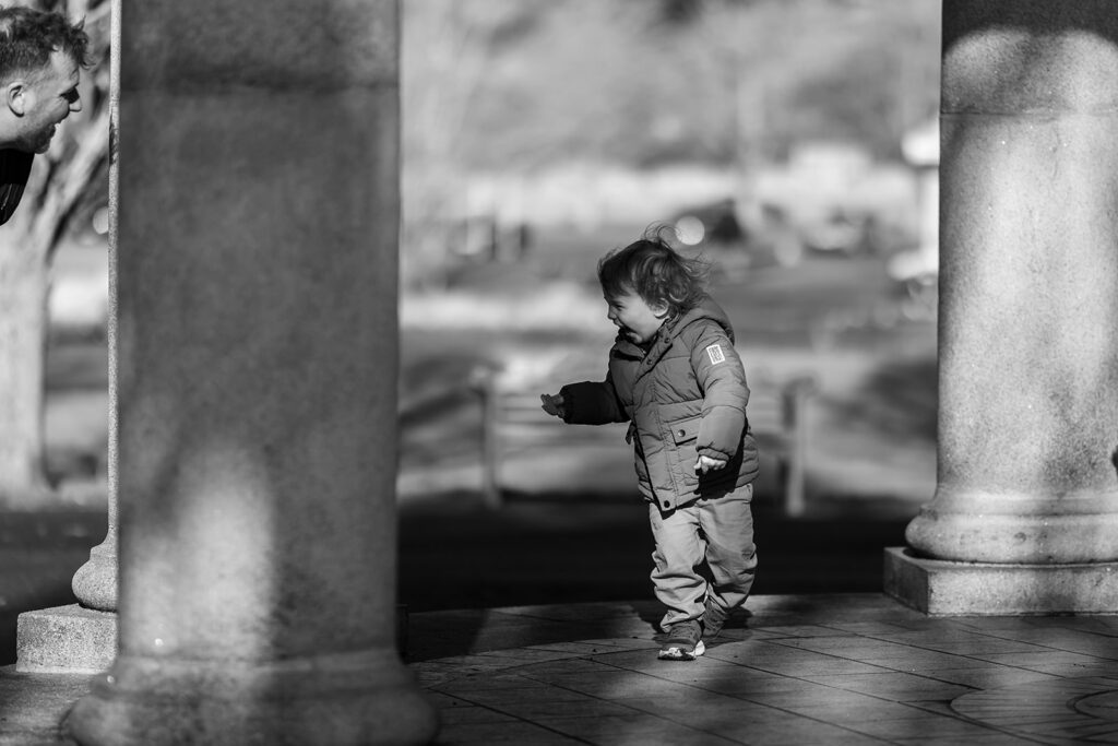 toddler playing hide and seek at dublin park