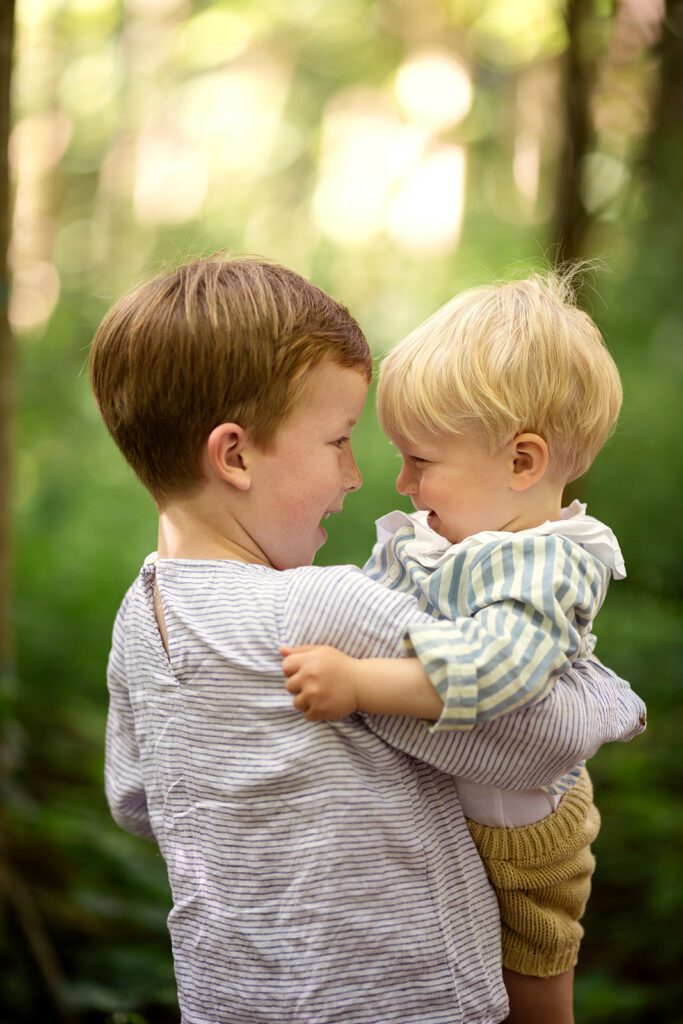 Older brother holding his little brother during a family session in Dublin