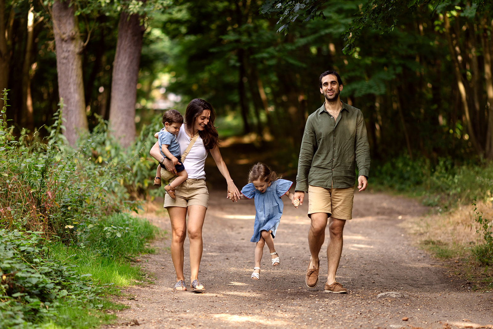 family walking hand in hand during a family photo session
