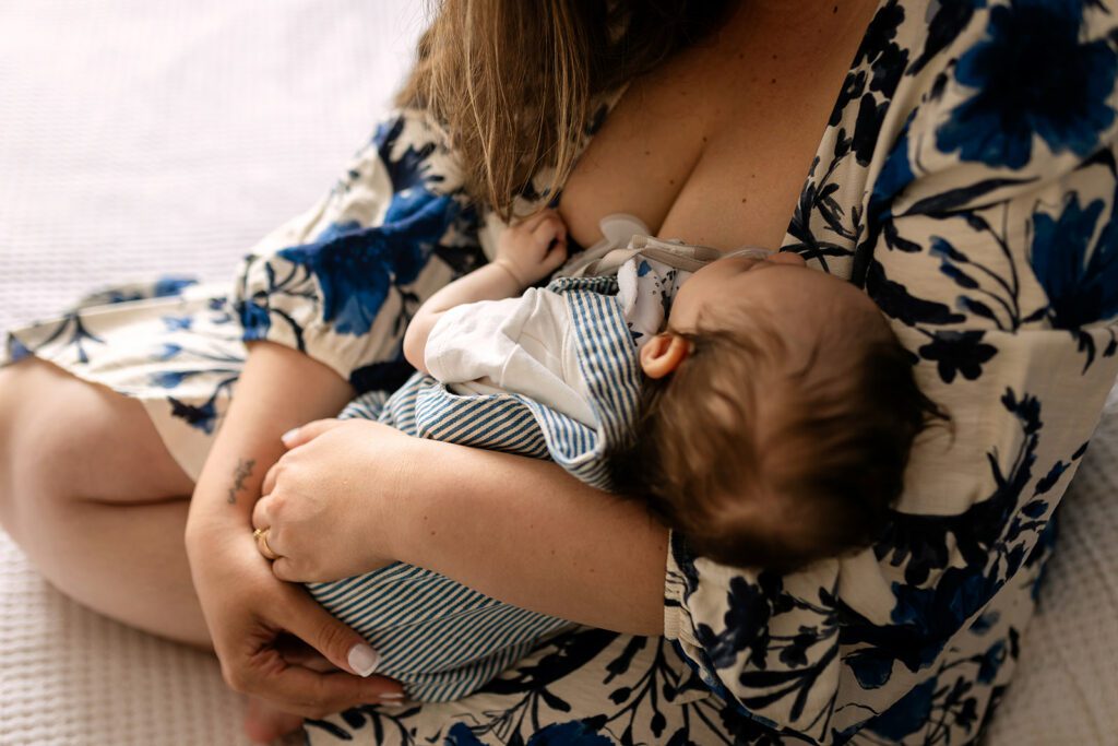 Mother breastfeeding her newborn baby at home in Dublin 15