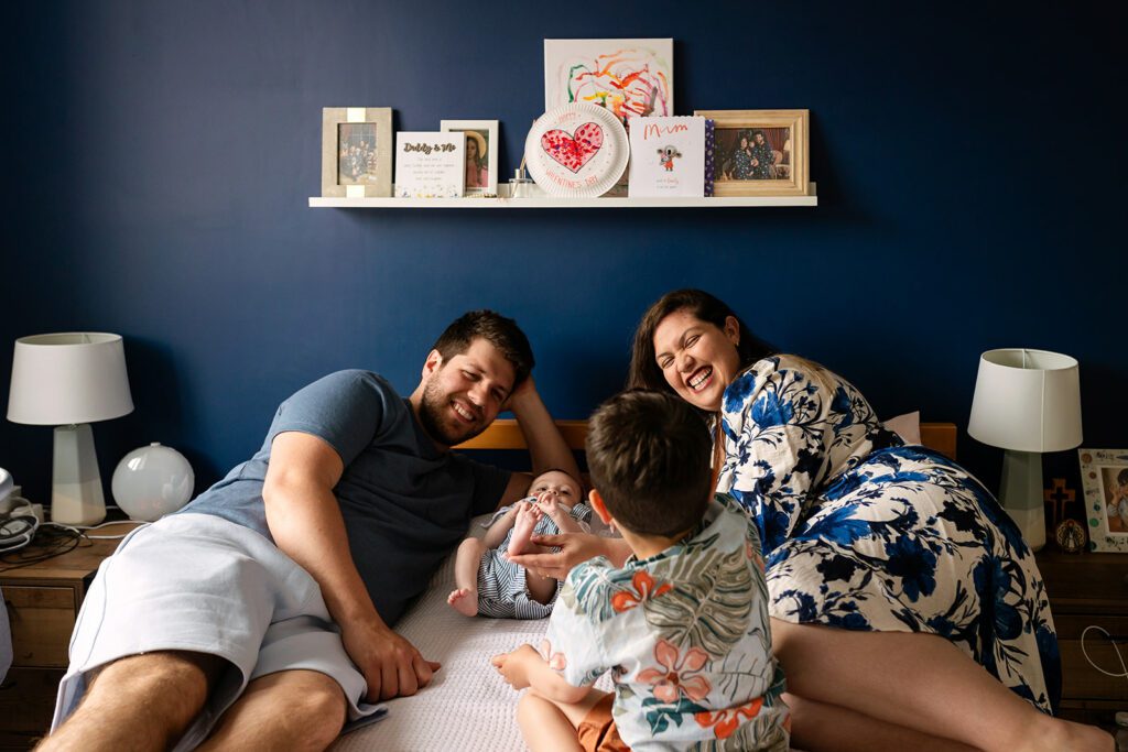 family playing on their bed What to expect during a Dublin family photo session
