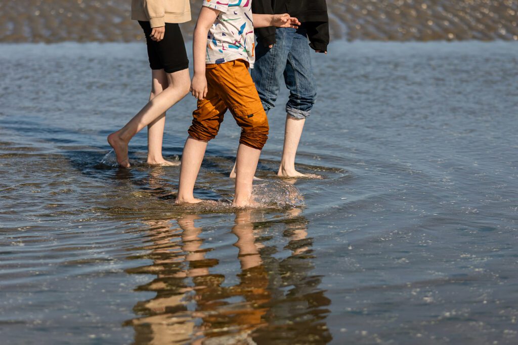 children walking along the beach in Dublin, Sandymount