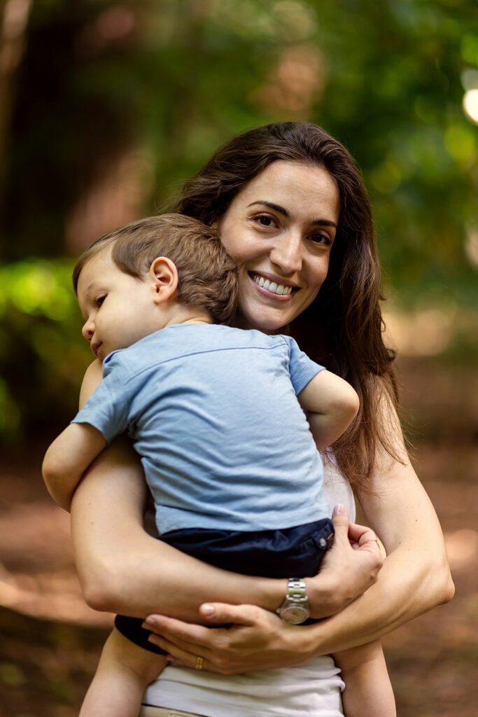 mother holding her baby and smiling