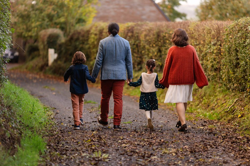 family walking outdoor for a Autumn family photo session in Dublin