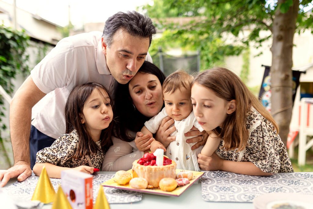 Natural Family Portrait of family celebrating a birthday