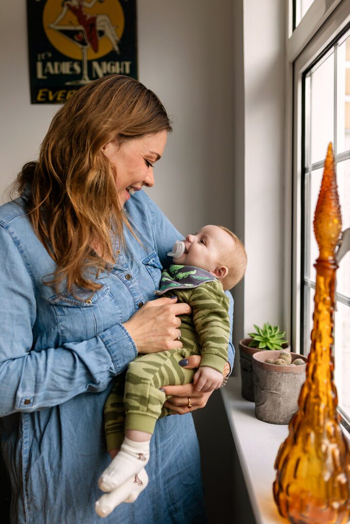 mum playing and smiling at her baby for Natural Family Portraits