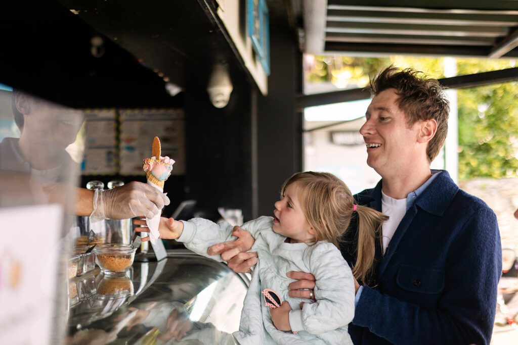 family buying icecream at sandymount beach in Dublin