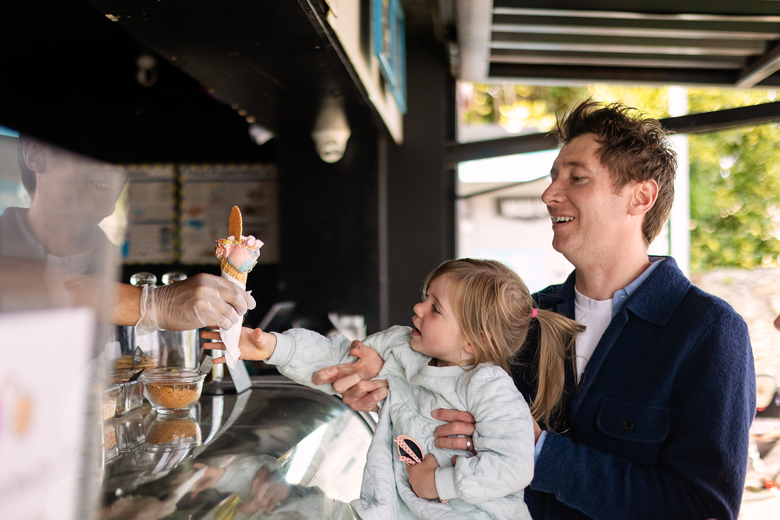 family buying icecream at sandymount beach in Dublin