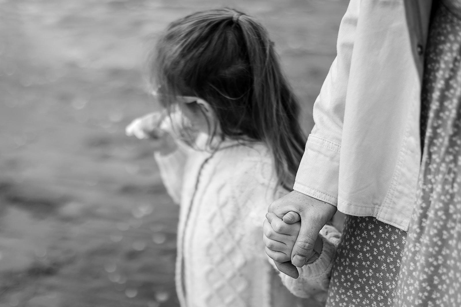 mother holding her toddler's hand