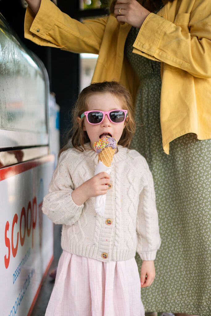 little girl eating ice cream during a Sandymount beach family photoshoot
